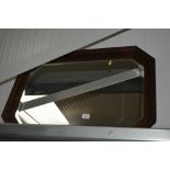 An oak framed bevel edged wall mirror