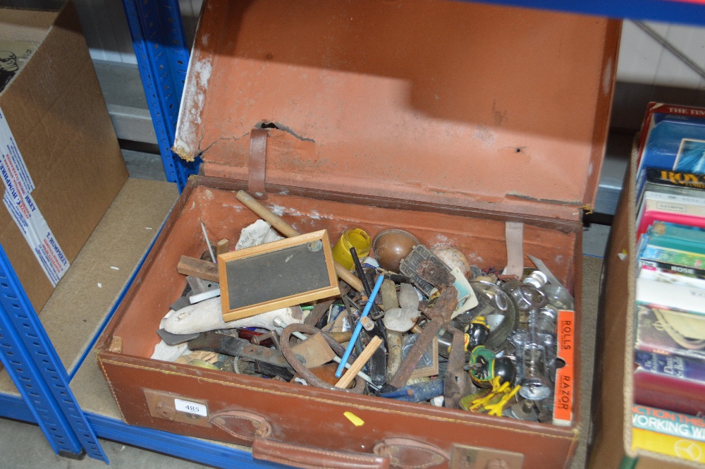 A suitcase and contents of various sundry items