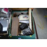 A box containing various unframed prints; a boxed