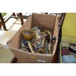 A box of various brassware