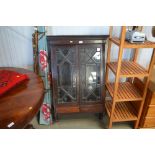 A mahogany two door hanging cabinet