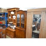 A walnut corner cabinet