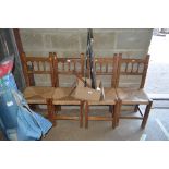 A set of four rush seated dining chairs