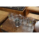 Five glass tankards and one pewter