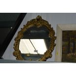 An ornate framed wall mirror