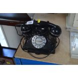 A reproduction rotary dial telephone