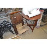 A trouser press; a bagatelle board; a cane framed mirror; a small wicker shelf; a circular topped t