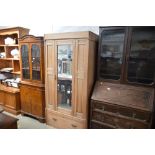 A satin wood Edwardian mirrored fronted wardrobe f