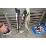 A quantity of long handled gardening tools