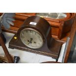 An oak cased two hole mantel clock