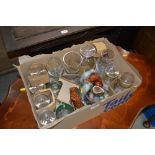 A box of various drinking glasses and miniatures