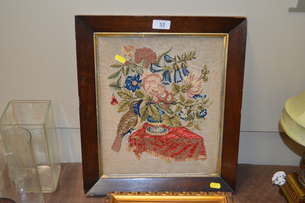 A Victorian needlework embroidery depicting a bird