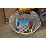 A wicker basket containing various sundries