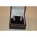 A pair of silver crystal amethyst set ear-rings