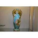 A Minton's twin handled vase decorated with an exo