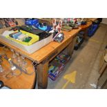 A stripped pine and metal bound kitchen table