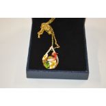 A 14ct gold plated necklace, the pendant decorated