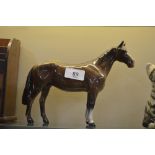 A Beswick brown glazed horse