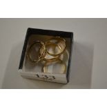 Three various 9ct gold rings; and a 22ct gold and