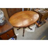 A Victorian walnut oval topped table