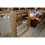 A large gilt decorated wall mirror
