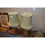 A pair of gilt metal table lamps and shades with f
