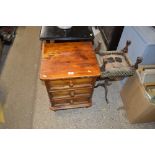 A pine three drawer bedside chest; a small wine ta