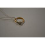 An 18ct gold single diamond set ring