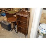 An oak bookcase of narrow proportions