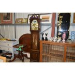 A modern oak cased grandfather clock with pendulum