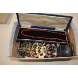 A shoe box of costume jewellery; an amber coloured