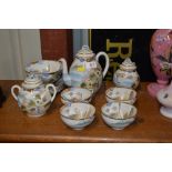 A Chinese 12 piece eggshell teaset decorated with