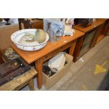 A light oak hall table fitted three drawers