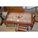 A glass topped coffee table inset with knot dioram