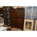 A heavy oak two section cupboard fitted two drawers