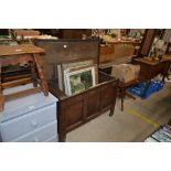 An antique oak panelled coffer with candle box int