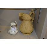 A Victorian jug with face mask decoration; and a s