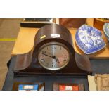 An oak cased three hole mantel clock