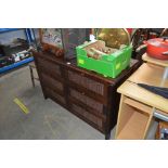 A wooden and wicker chest fitted six drawers