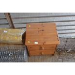 A pine bedside chest fitted two drawers