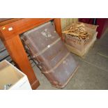 A cane and metal bound travelling trunk