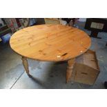 A pine circular top dining table