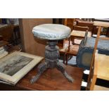 A revolving Victorian piano stool