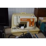 A Frister and Rossman electric sewing machine, in