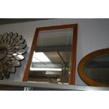 An oblong bevelled edged wall mirror