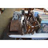 A magazine rack together with a carved paper rack