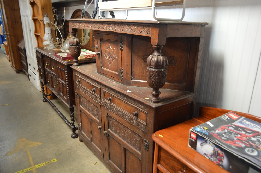 An oak court cupboard fitted two drawers