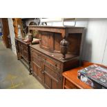 An oak court cupboard fitted two drawers