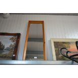 A pine framed oblong wall mirror