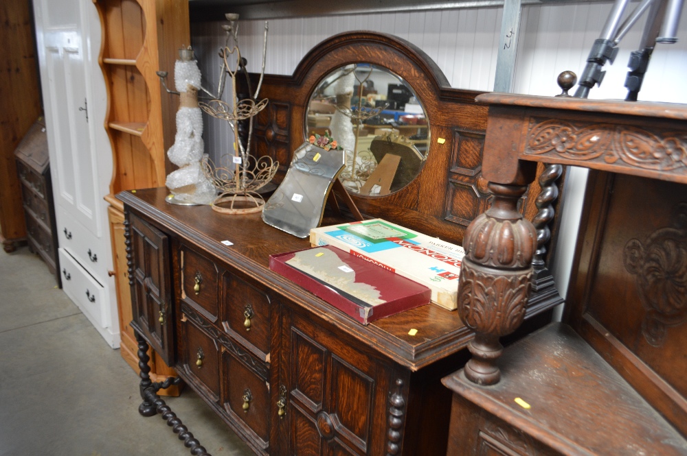 An oak and mirrored back sideboard